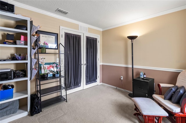 living area with carpet, crown molding, and a textured ceiling