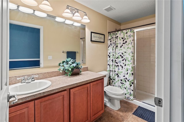 bathroom featuring toilet, tile patterned flooring, vanity, curtained shower, and a textured ceiling