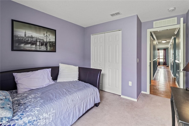 bedroom with carpet floors and a closet