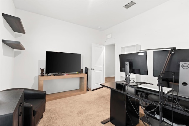 carpeted home office with visible vents