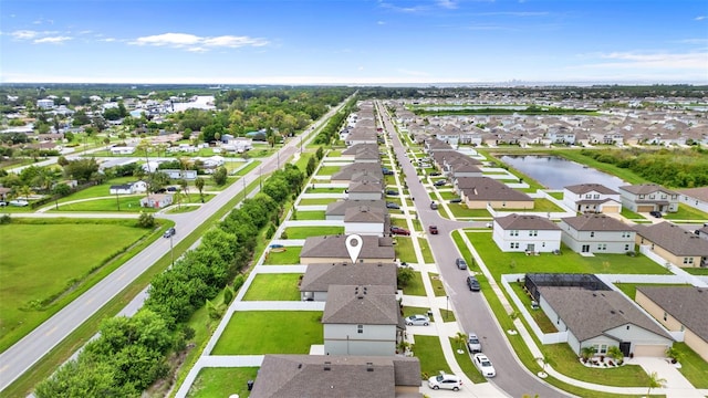 aerial view featuring a residential view and a water view