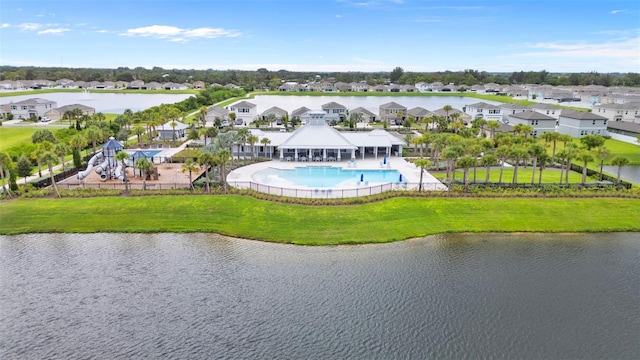 birds eye view of property with a water view and a residential view