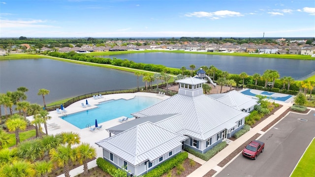 drone / aerial view with a water view and a residential view