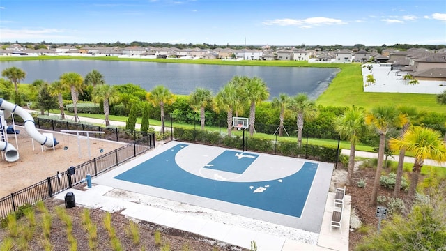 view of sport court with community basketball court, a water view, fence, and a residential view