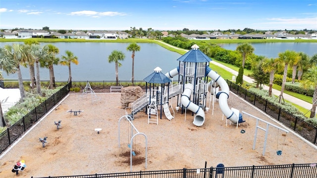 community playground featuring a water view and fence