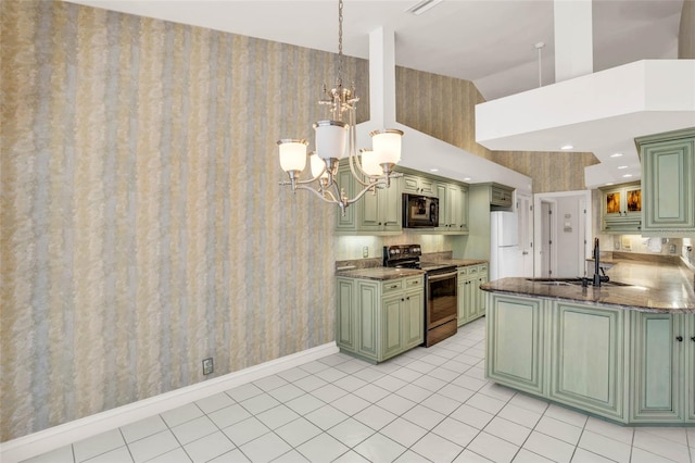 kitchen featuring kitchen peninsula, green cabinets, sink, electric range, and a notable chandelier