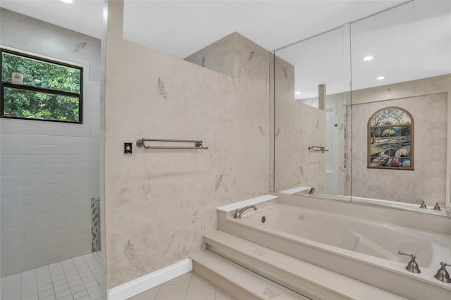 bathroom featuring tile patterned floors and independent shower and bath