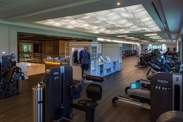 gym with dark hardwood / wood-style floors