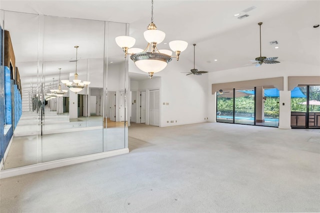 spare room featuring light carpet, a healthy amount of sunlight, and ceiling fan with notable chandelier