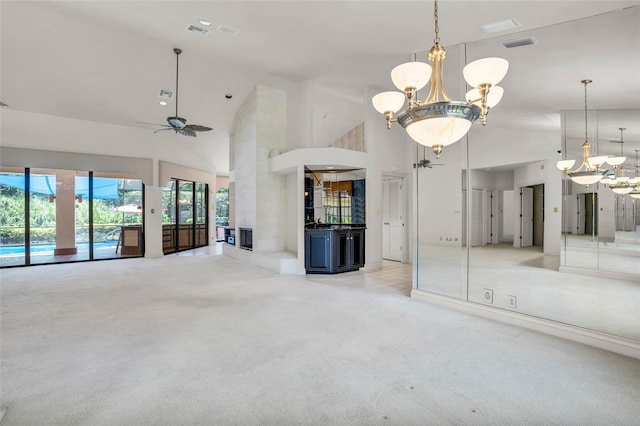 unfurnished living room featuring light colored carpet, high vaulted ceiling, and ceiling fan