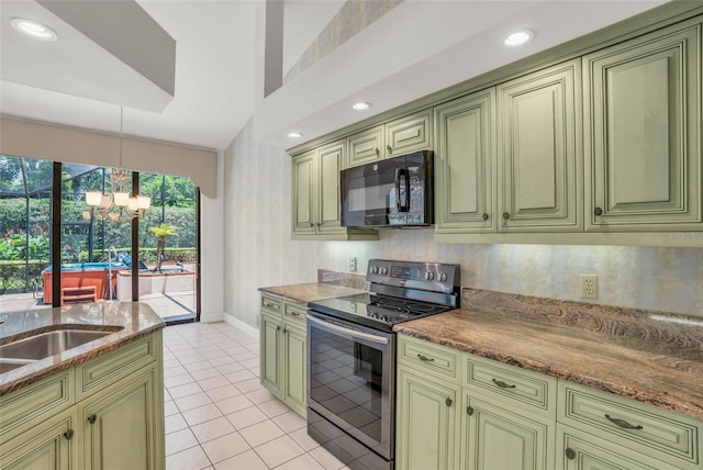 kitchen with green cabinets, stainless steel electric range, decorative light fixtures, an inviting chandelier, and light stone counters