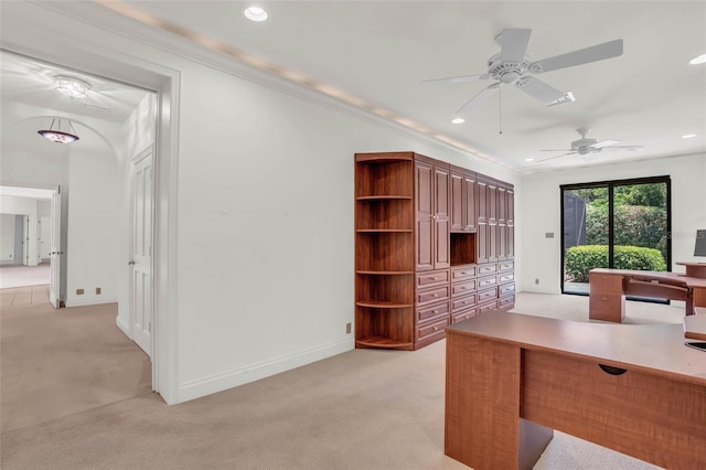 home office with crown molding, light colored carpet, and ceiling fan