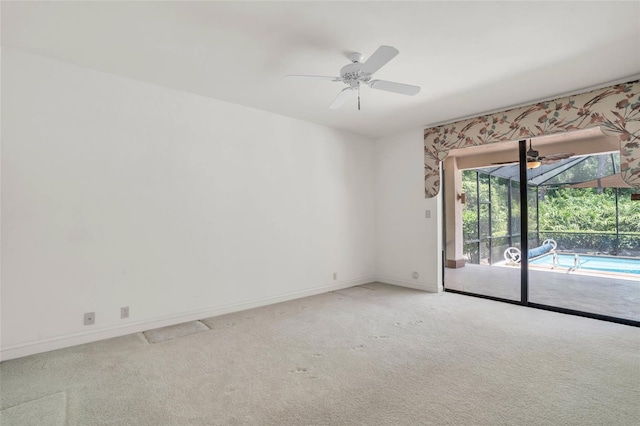 empty room featuring carpet flooring and ceiling fan