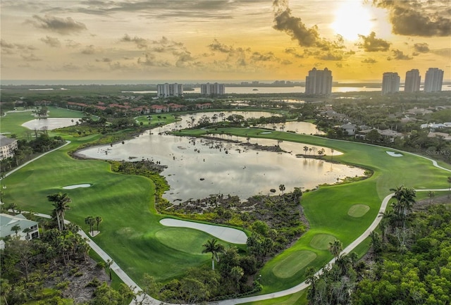 aerial view at dusk with a water view