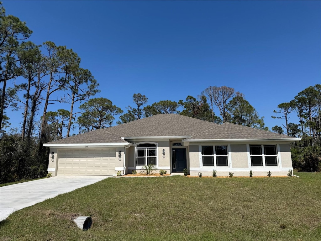 ranch-style house featuring stucco siding, a front lawn, roof with shingles, concrete driveway, and a garage