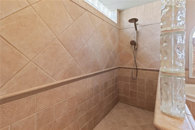 full bathroom featuring a tile shower