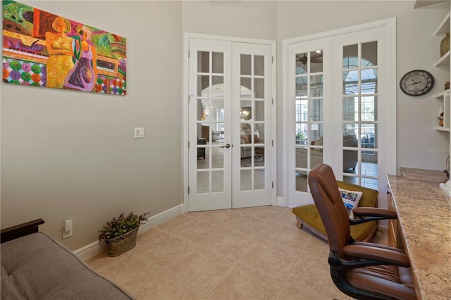 office space featuring light tile patterned floors, french doors, and baseboards