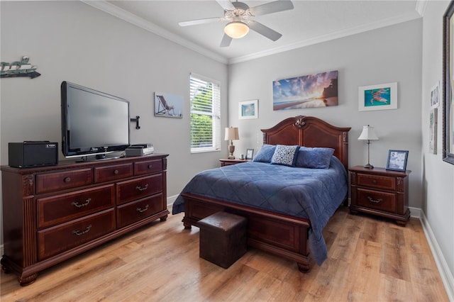 bedroom featuring crown molding, baseboards, a ceiling fan, and light wood-style floors