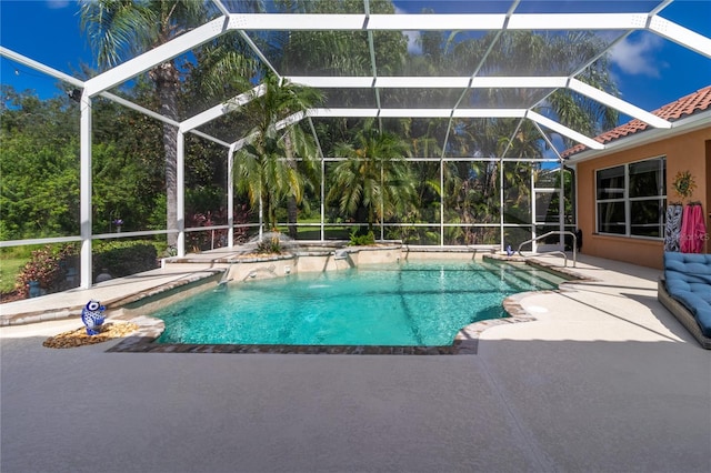 outdoor pool with a lanai and a patio