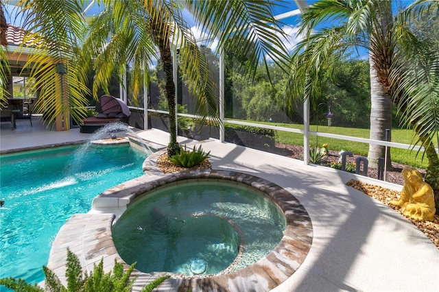 pool with an in ground hot tub, a patio, and a lanai