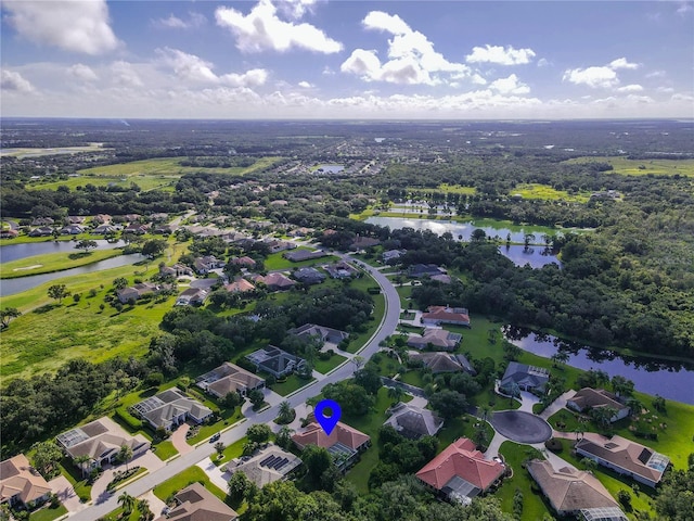 bird's eye view with a water view and a residential view