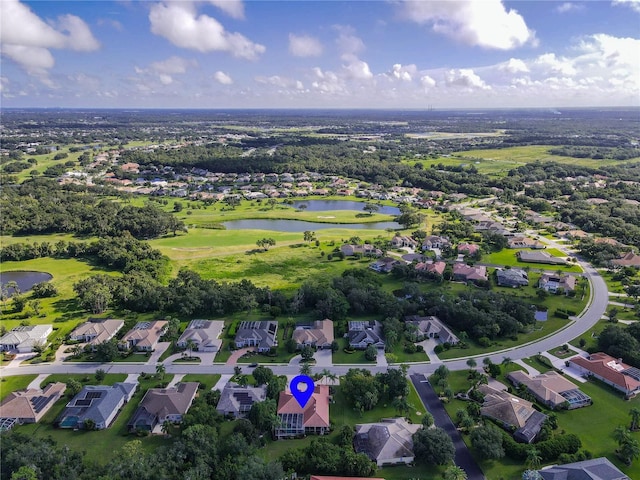 aerial view featuring a residential view, a water view, and golf course view