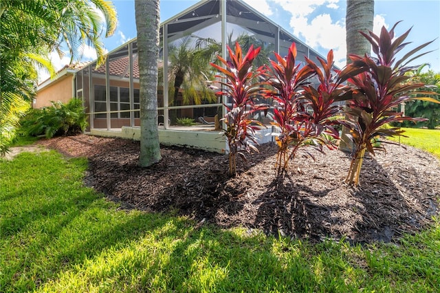 view of yard featuring glass enclosure