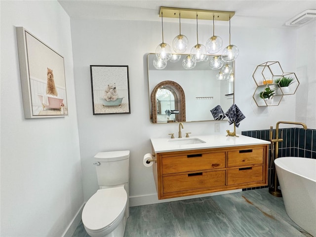 bathroom featuring vanity, a bath, toilet, and hardwood / wood-style flooring