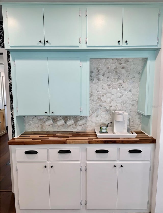 kitchen with backsplash and wood counters