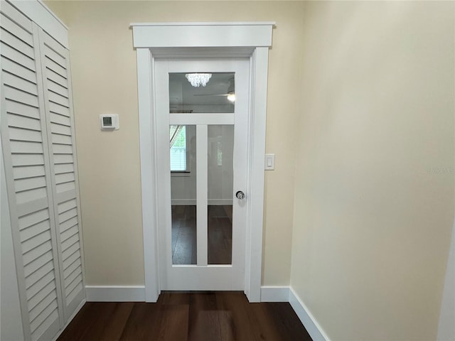 corridor with wood-type flooring