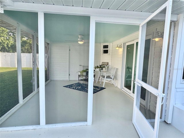 sunroom featuring ceiling fan