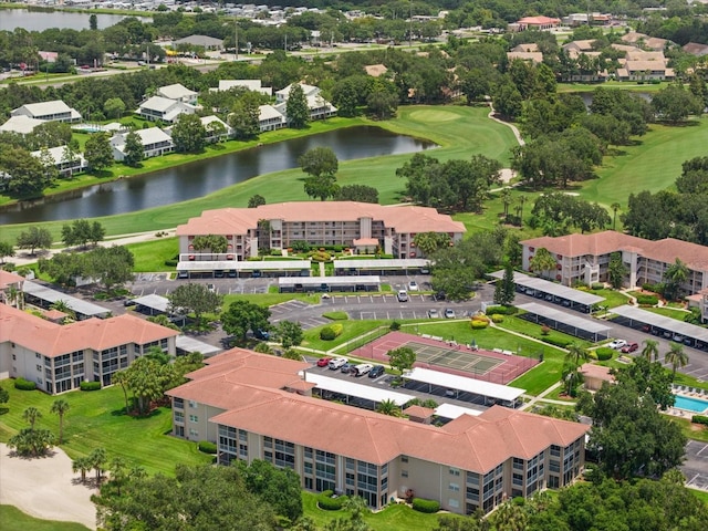 drone / aerial view featuring a water view and golf course view