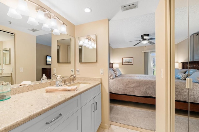 bathroom featuring tile patterned floors, visible vents, ceiling fan, and ensuite bathroom