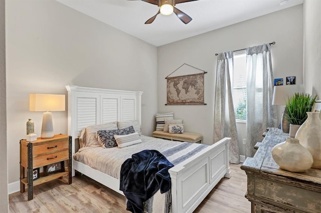 bedroom with light hardwood / wood-style flooring and ceiling fan