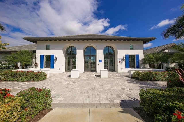 back of property featuring french doors