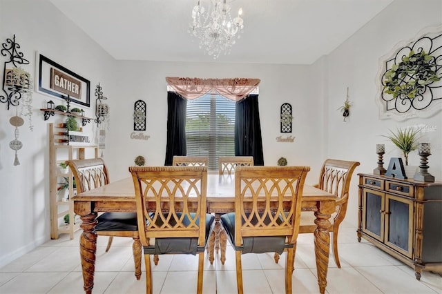 tiled dining room with an inviting chandelier