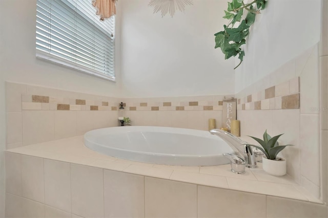 bathroom featuring a relaxing tiled tub