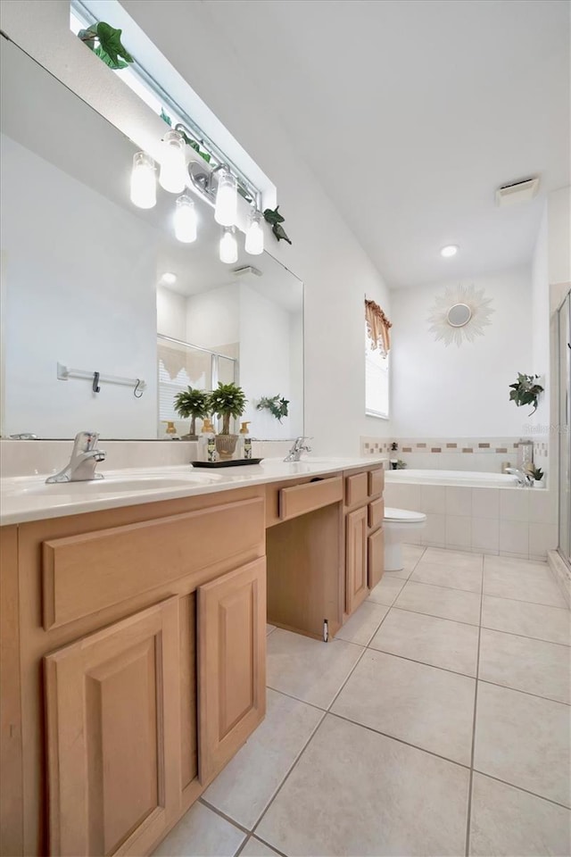 full bathroom with tile patterned flooring, toilet, independent shower and bath, and vanity