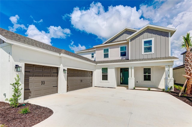 view of front of property with a garage