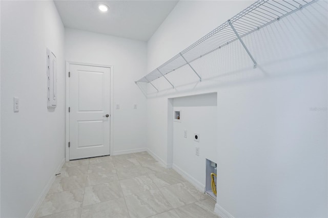 clothes washing area with washer hookup, marble finish floor, electric dryer hookup, laundry area, and baseboards