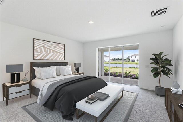 bedroom with light colored carpet, visible vents, and access to exterior