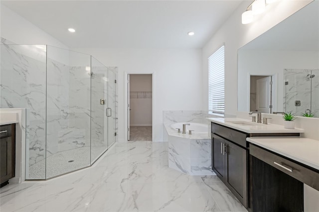 full bathroom featuring marble finish floor, a marble finish shower, and vanity