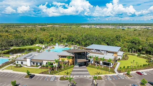 bird's eye view with a water view and a view of trees