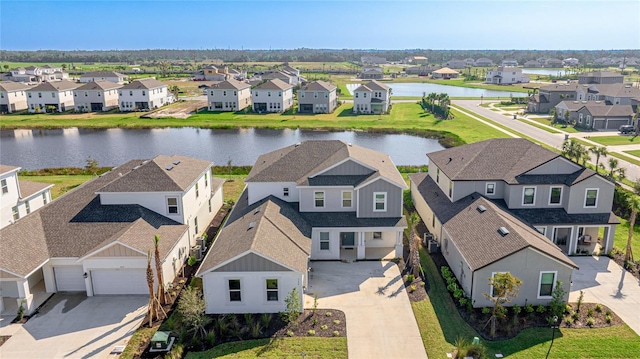 bird's eye view featuring a water view and a residential view