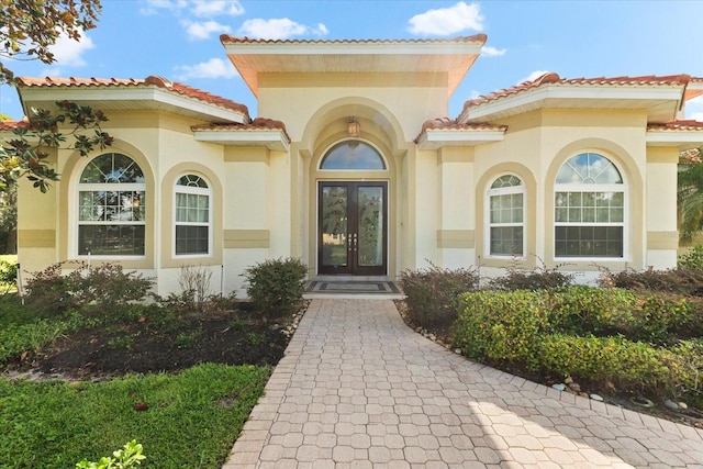 property entrance featuring french doors