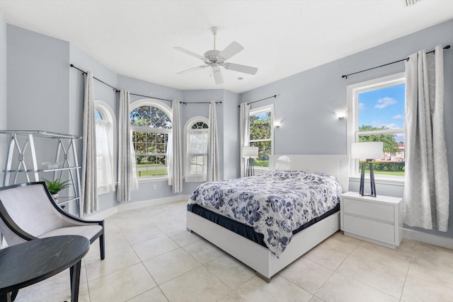 tiled bedroom with ceiling fan