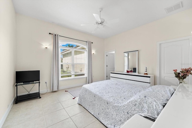 bedroom featuring light tile patterned floors and ceiling fan