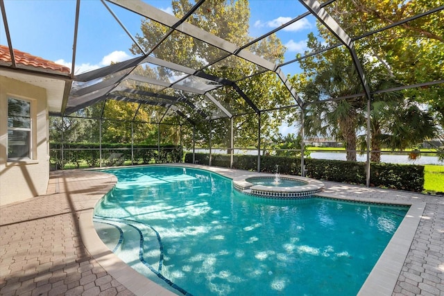 view of swimming pool featuring an in ground hot tub, a patio, and a lanai