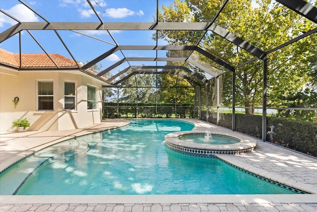 view of swimming pool with a lanai and an in ground hot tub