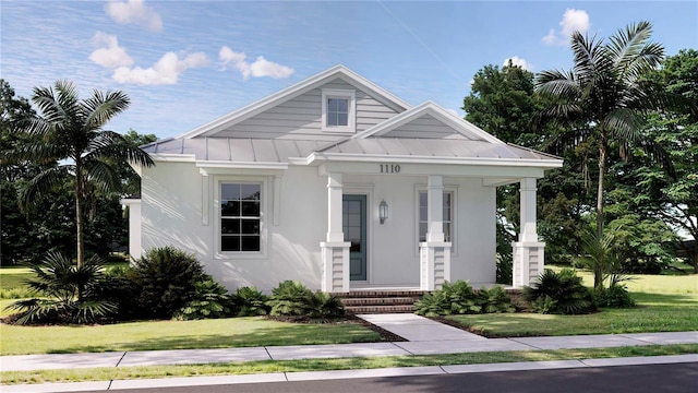 view of front of property with covered porch and a front lawn